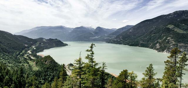 view of green lake and mountains